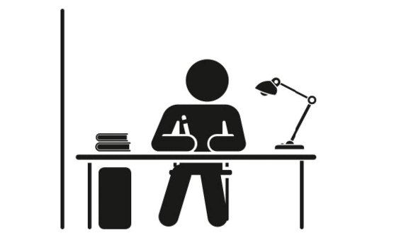 Pictogram: Person at their own desk with a lamp, a roll container and a screen on the side