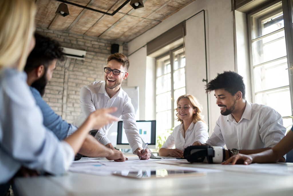 Laughing team during a meeting at the table
