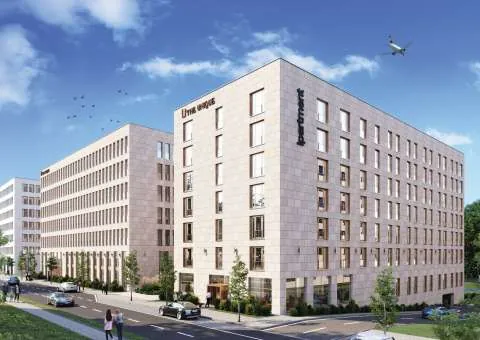 Visualization of two bright building complexes under a blue sky with a departing plane, ipartment Berlin Airport