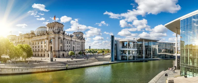 Reichstag building and Spree riverbank in the Berlin government district in sunshine