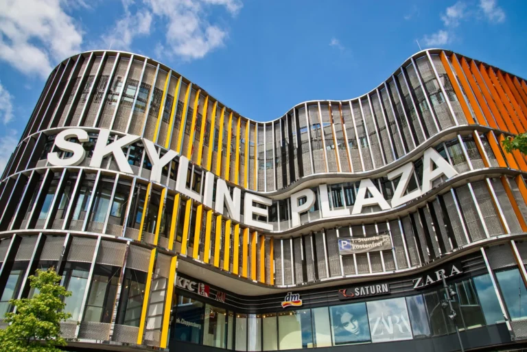 Curved facade of the Skyline Plaza shopping center in the European Quarter of Frankfurt under a blue sky